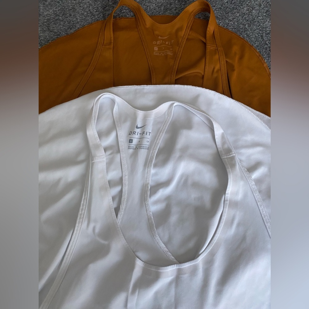 Two Nike workout tops